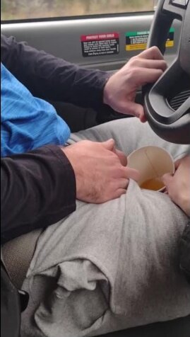 Girl Drinks a Big Cup of very Yellow piss in a car
