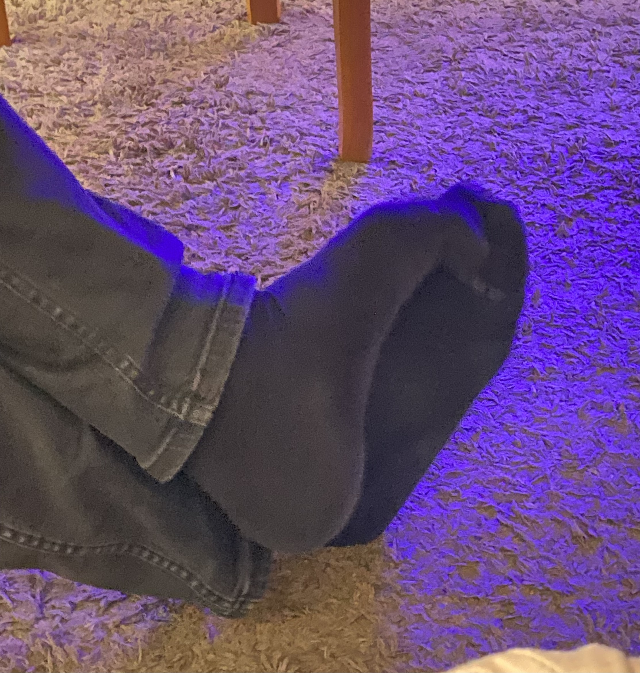 my uncle's black hot socks swinging under the table.