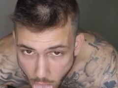 Straight tatted man sucking a dildo