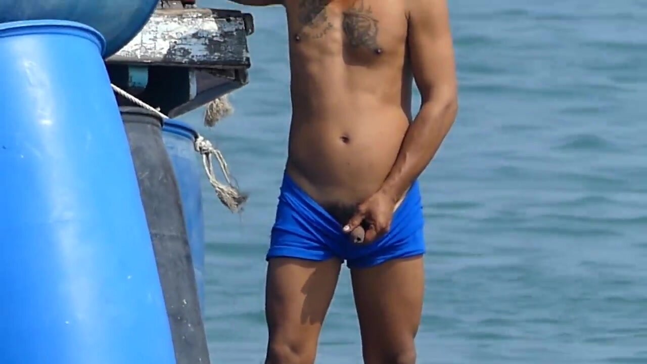 Asian guy caught pissing in the ocean