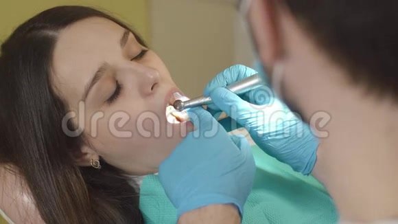 Brunette having teeth drilled