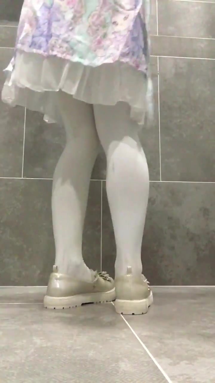 Girl pee in her white tights - video 2