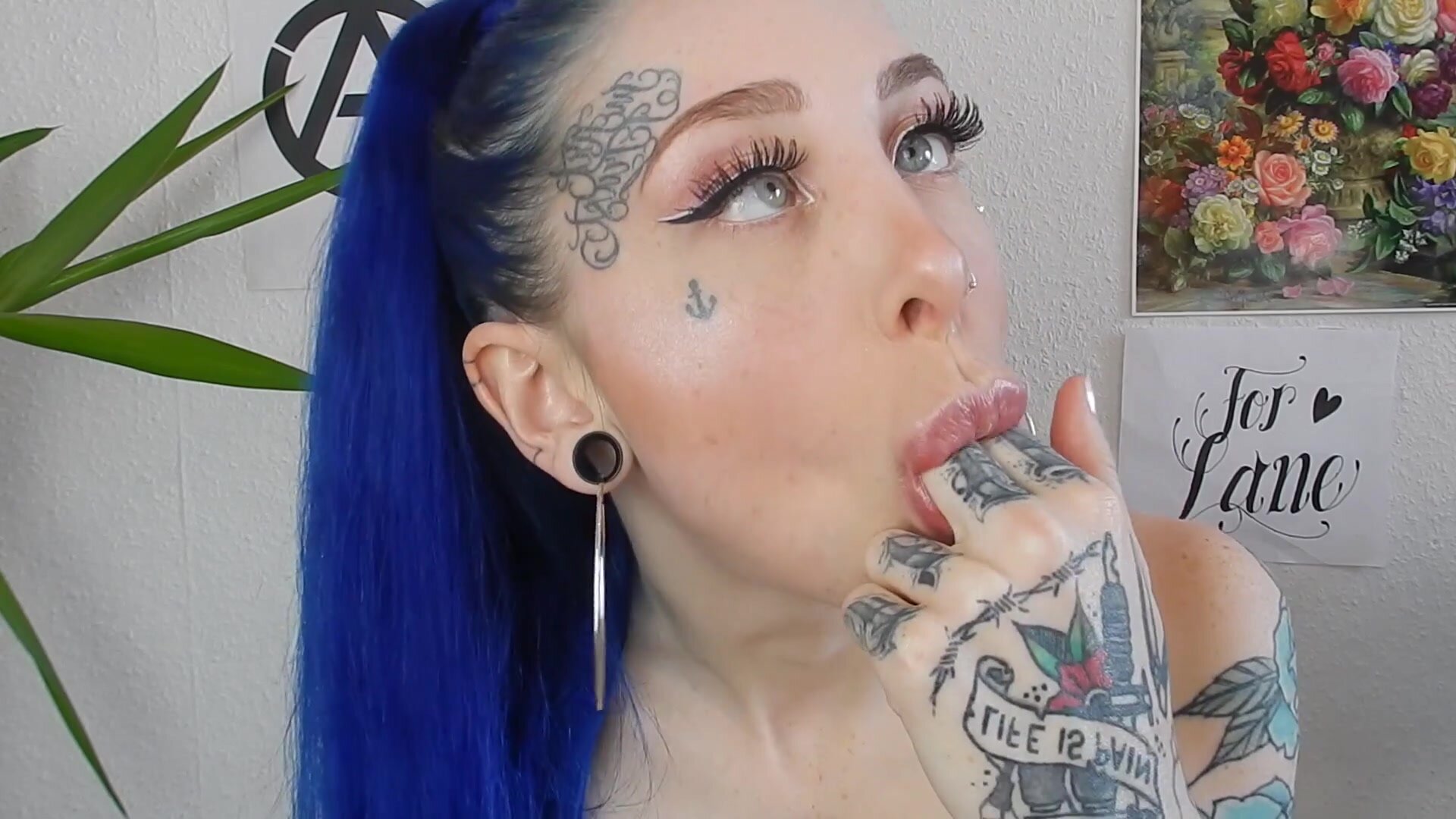 A beautiful girl with blue hair makes herself puke