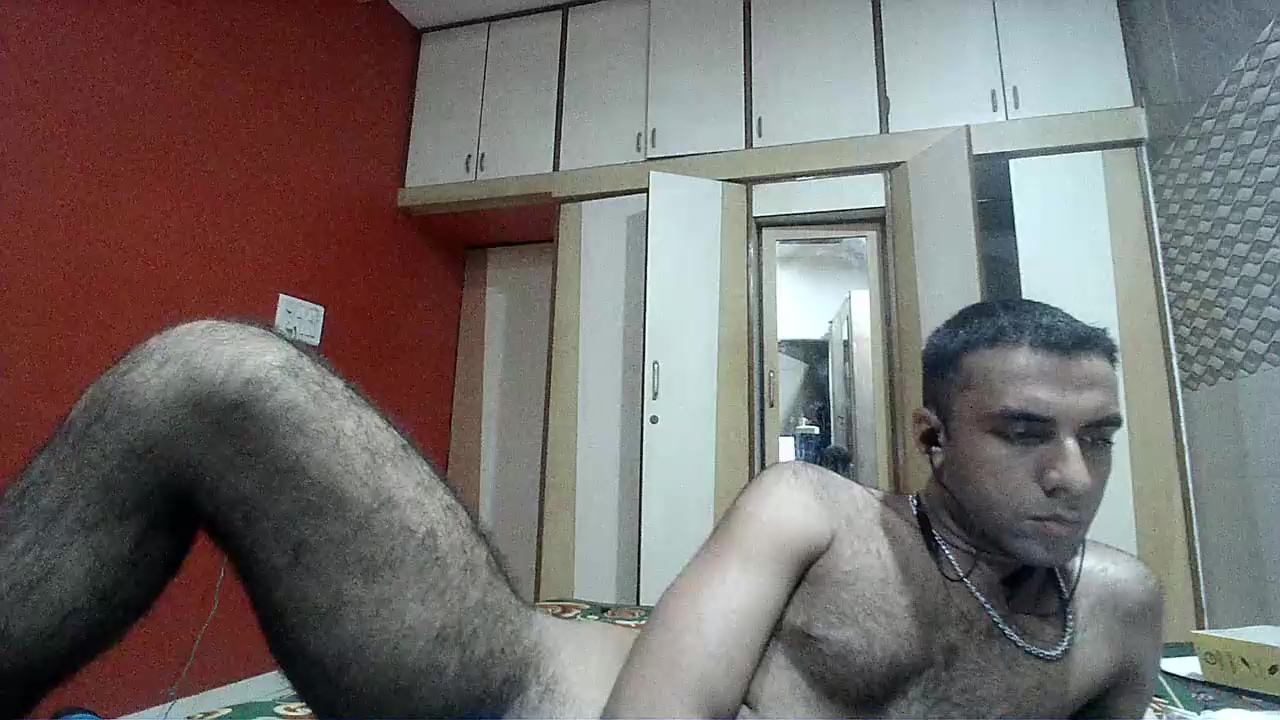 Hairy brown boy naked on bed (no cock)