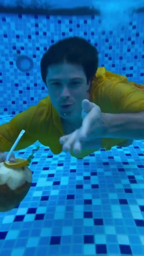 Clothed russian barefaced underwater