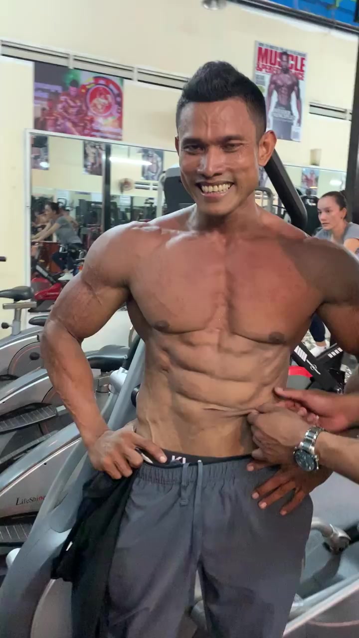 Bodybuilder with skin-tight Abs