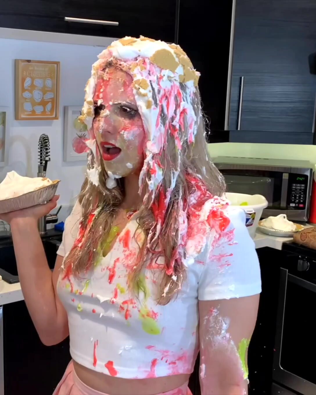 BLONDE GIRL GETS IN THE FACE IN A PIE FIGHT