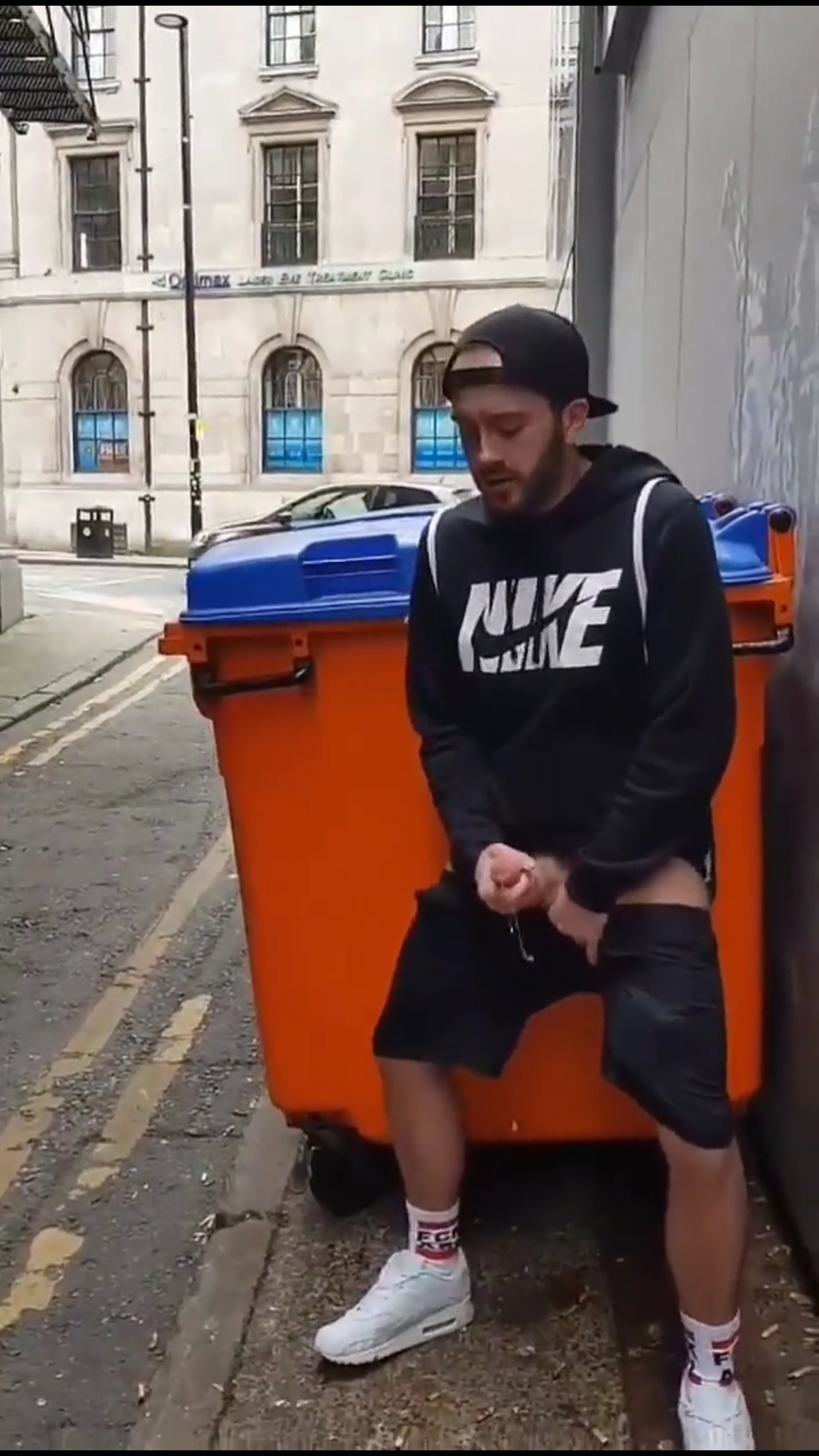 Wanking by a bin