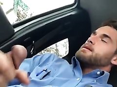Uniformed man cumming in the car