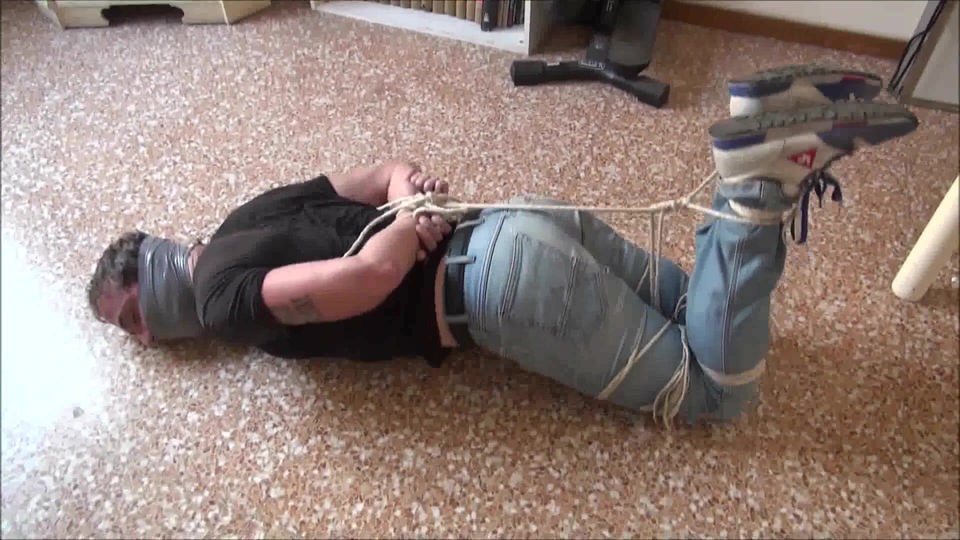 Hot man bound and gagged on the floor - video 2