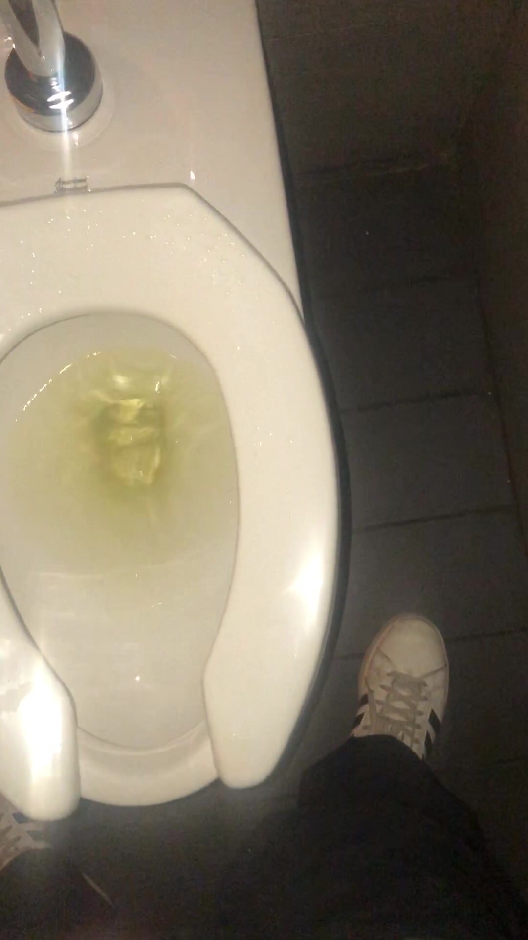 Messy piss in a restaurant restroom