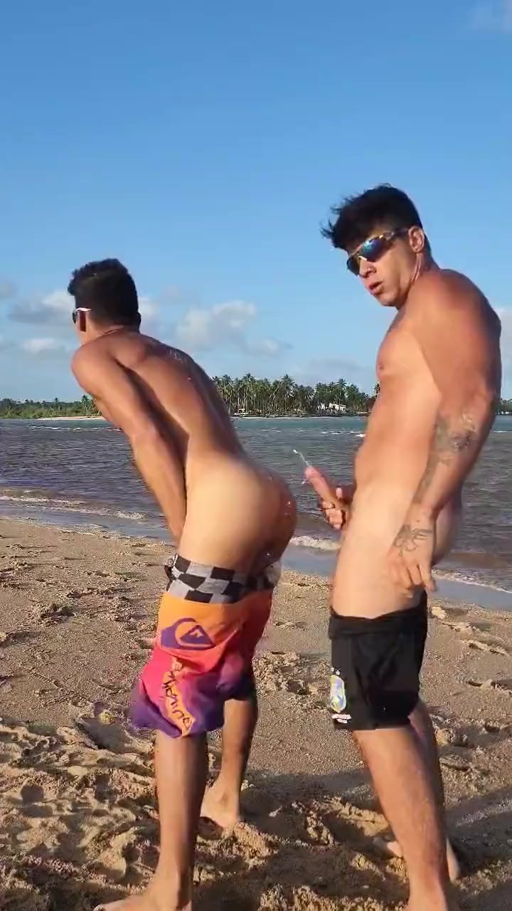 Hot guys doing naughty on the beach.
