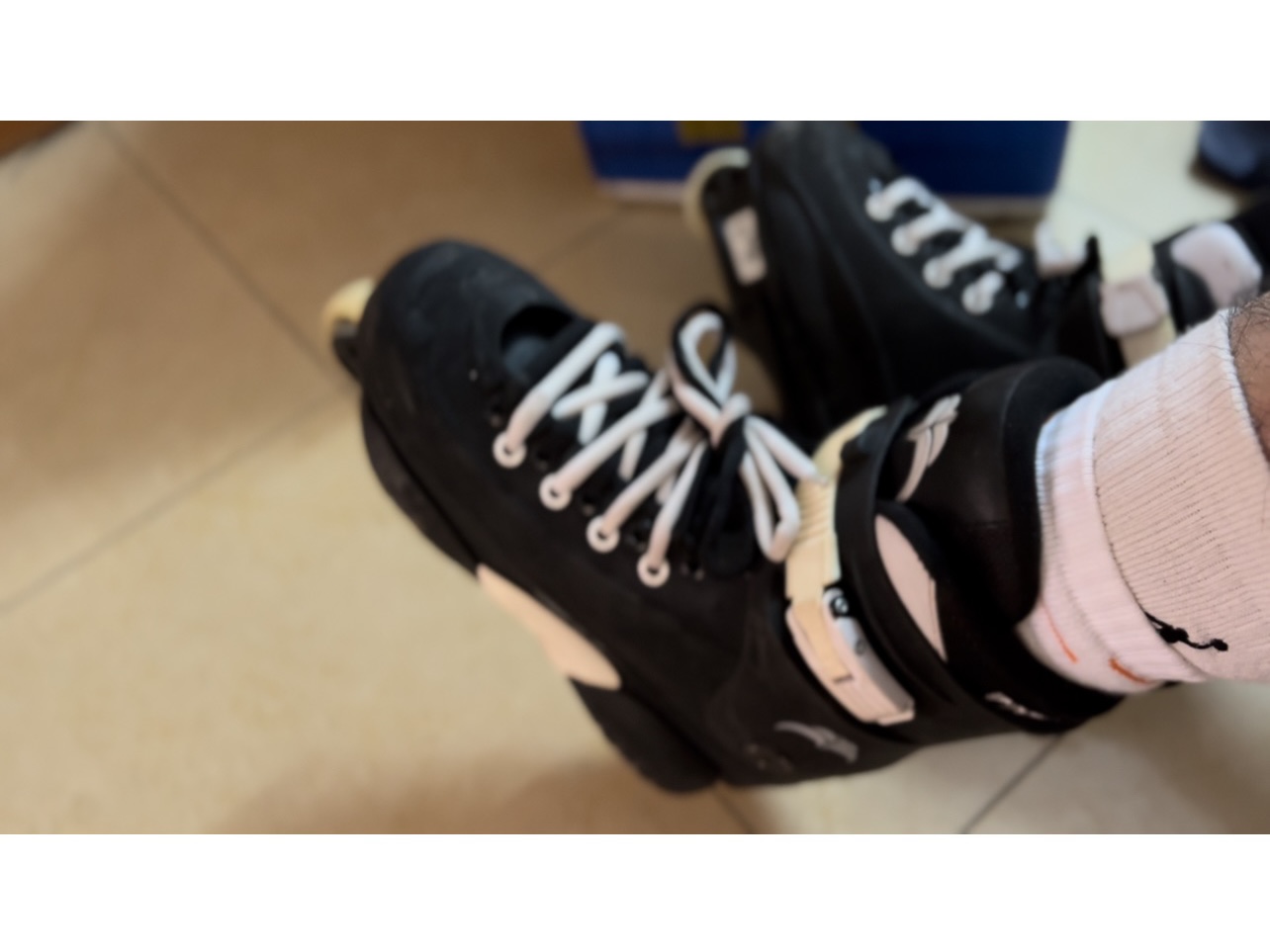 two pairs of socks with rollerskates