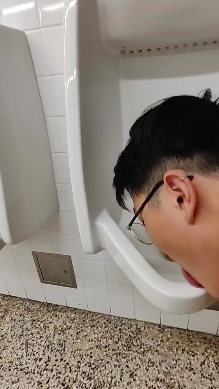 naked fag in public washroom licks urinals