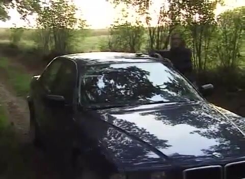 Lady with a car poops in the woods..