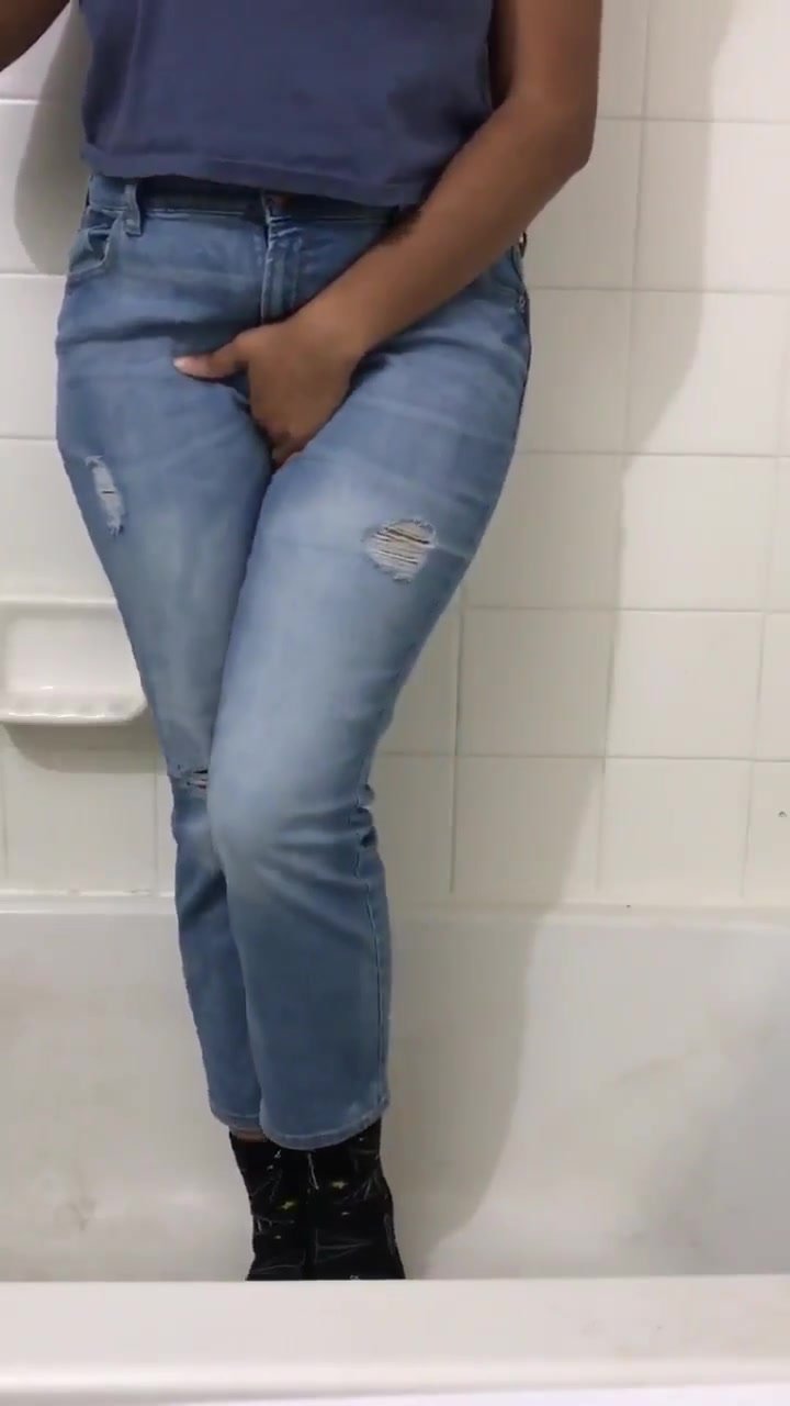 Ebony wetting blue jeans