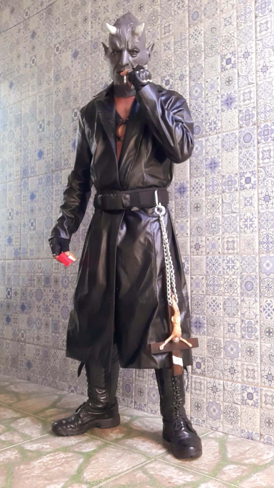 Demon with leather coat, crucifix, smoking