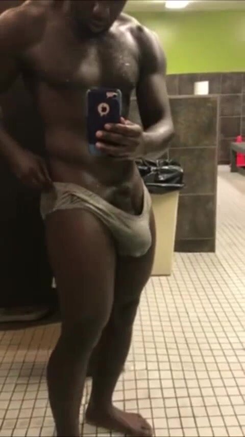 Black muscle hunk locker room bulge