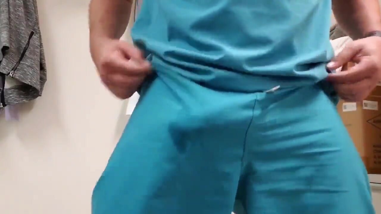 Freeballing doctor bulges and precums in scrubs