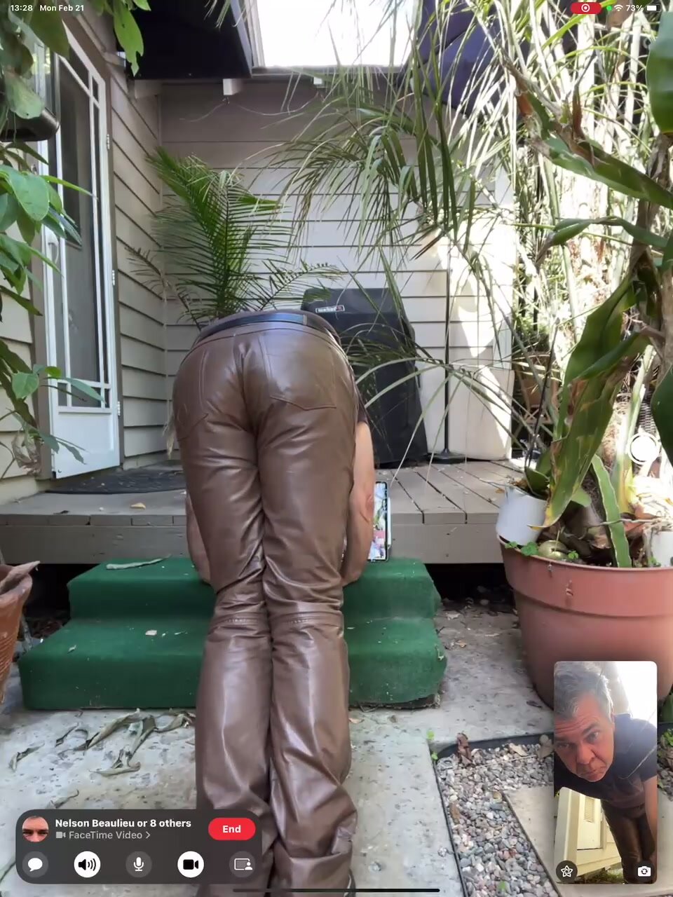 man in brown leather pants