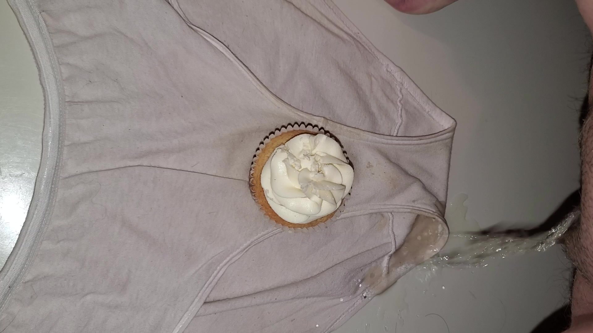 Pissing on a cupcake and underwear