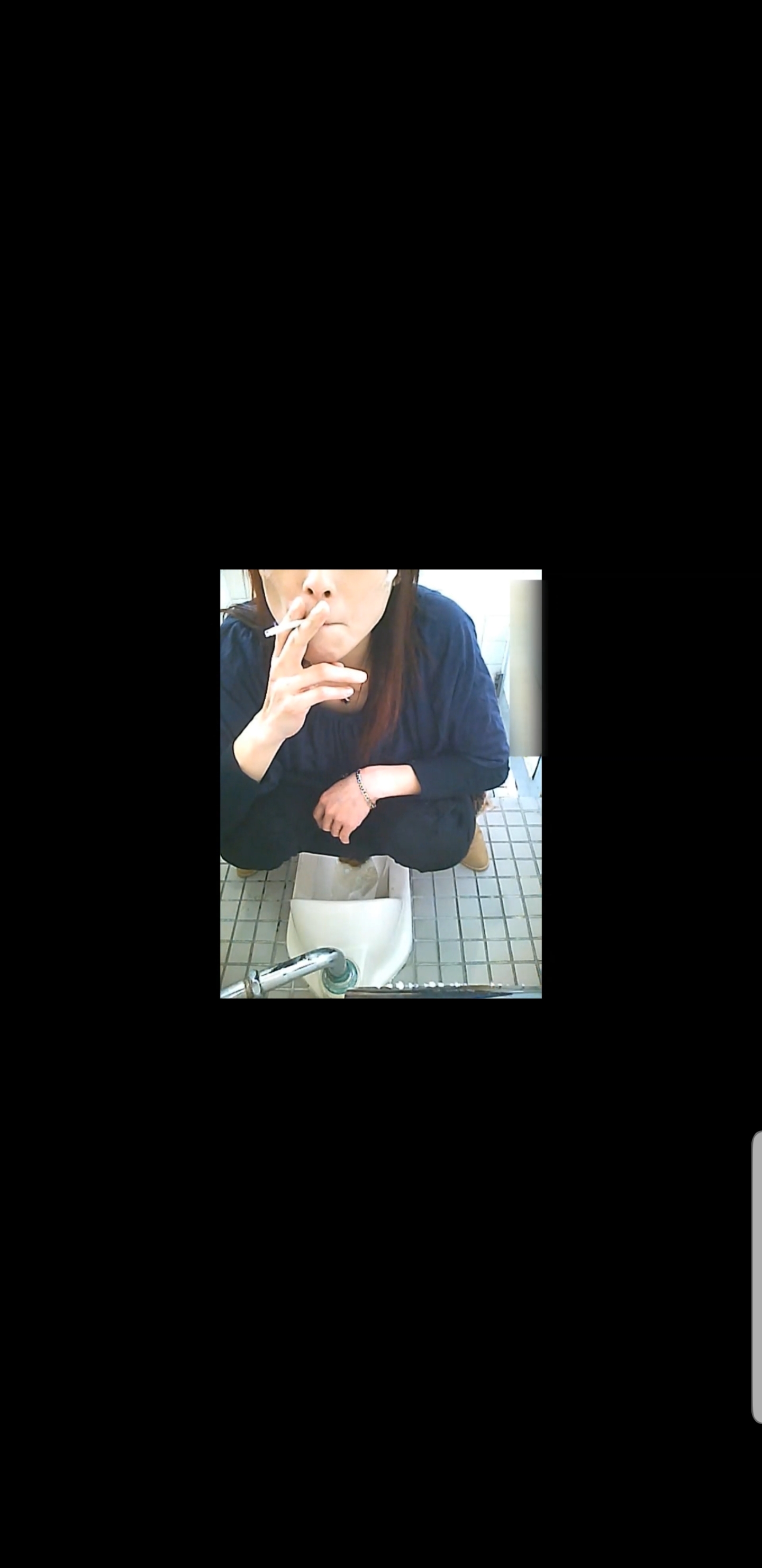 Japanese milf smoking while pooping