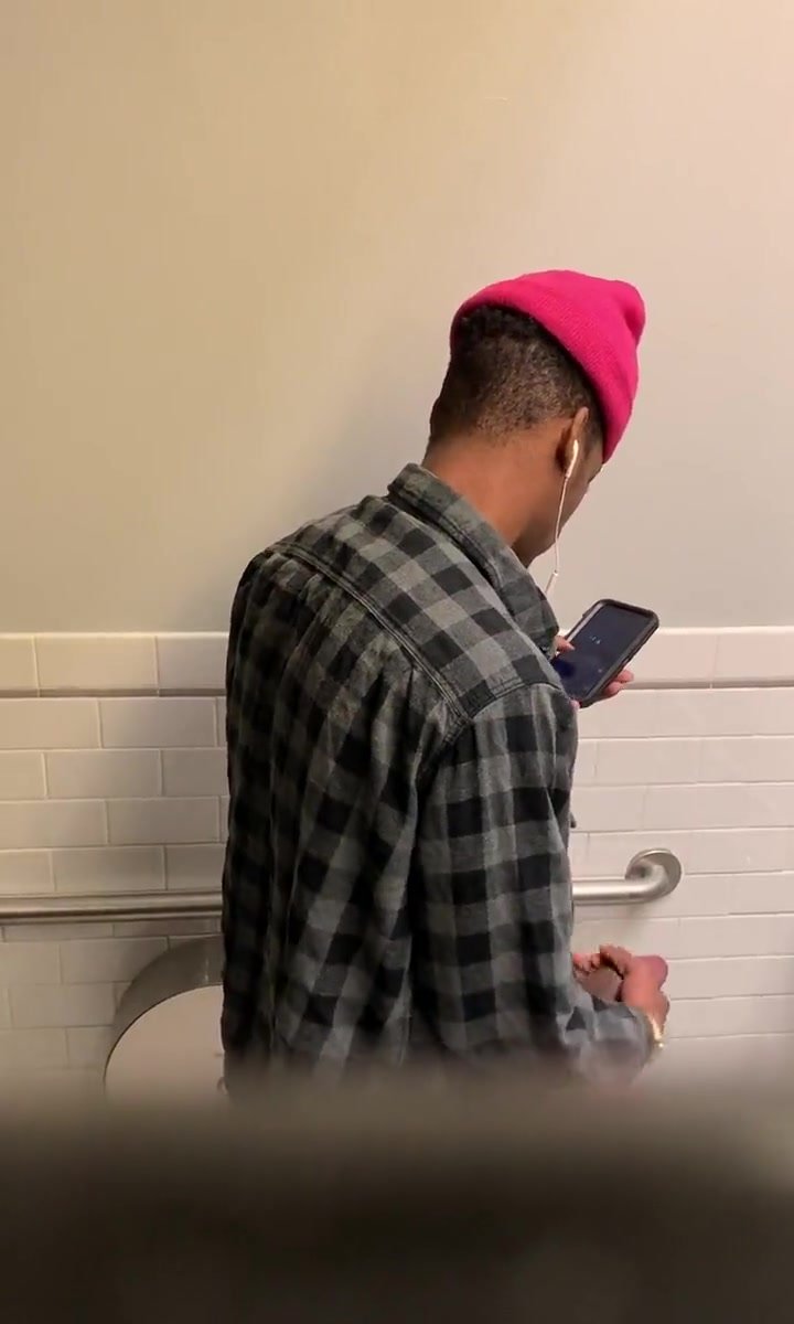 Guy wanking in public toilet