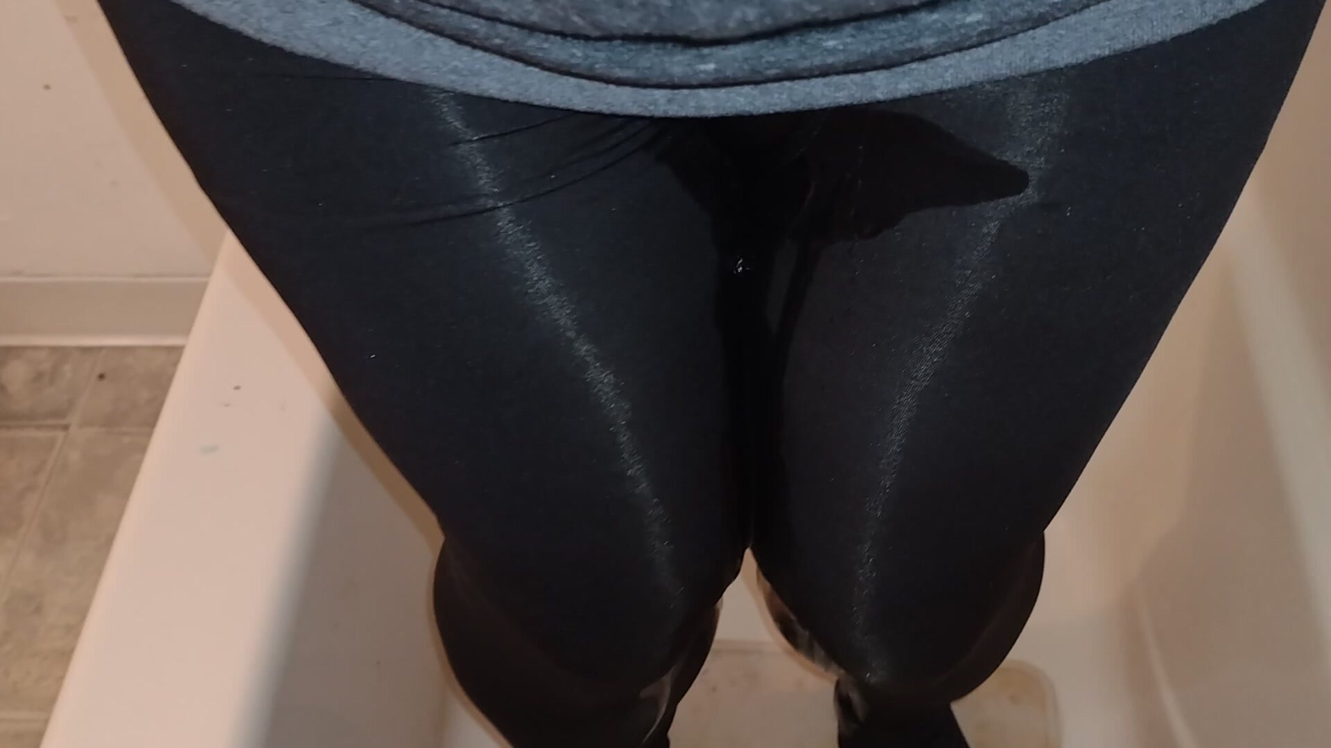Girl pees leggings in shower