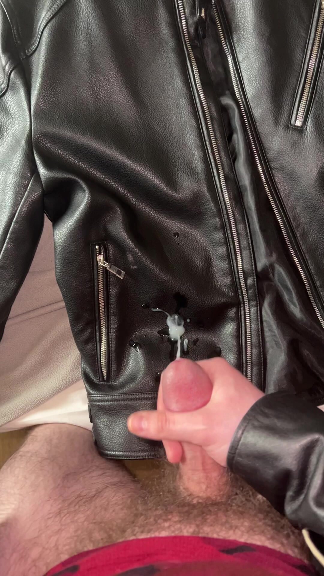 Cumming on a leather jacket