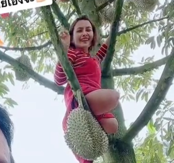 Cute Asian dak amputeee climbing tree