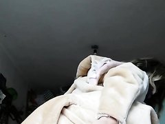 Girl removes her pajama to reveal her diaper