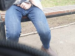 Desperation and leaking in jeans in public park