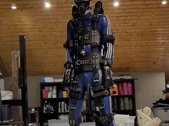 Blue rubber gimp suspended with gas mask