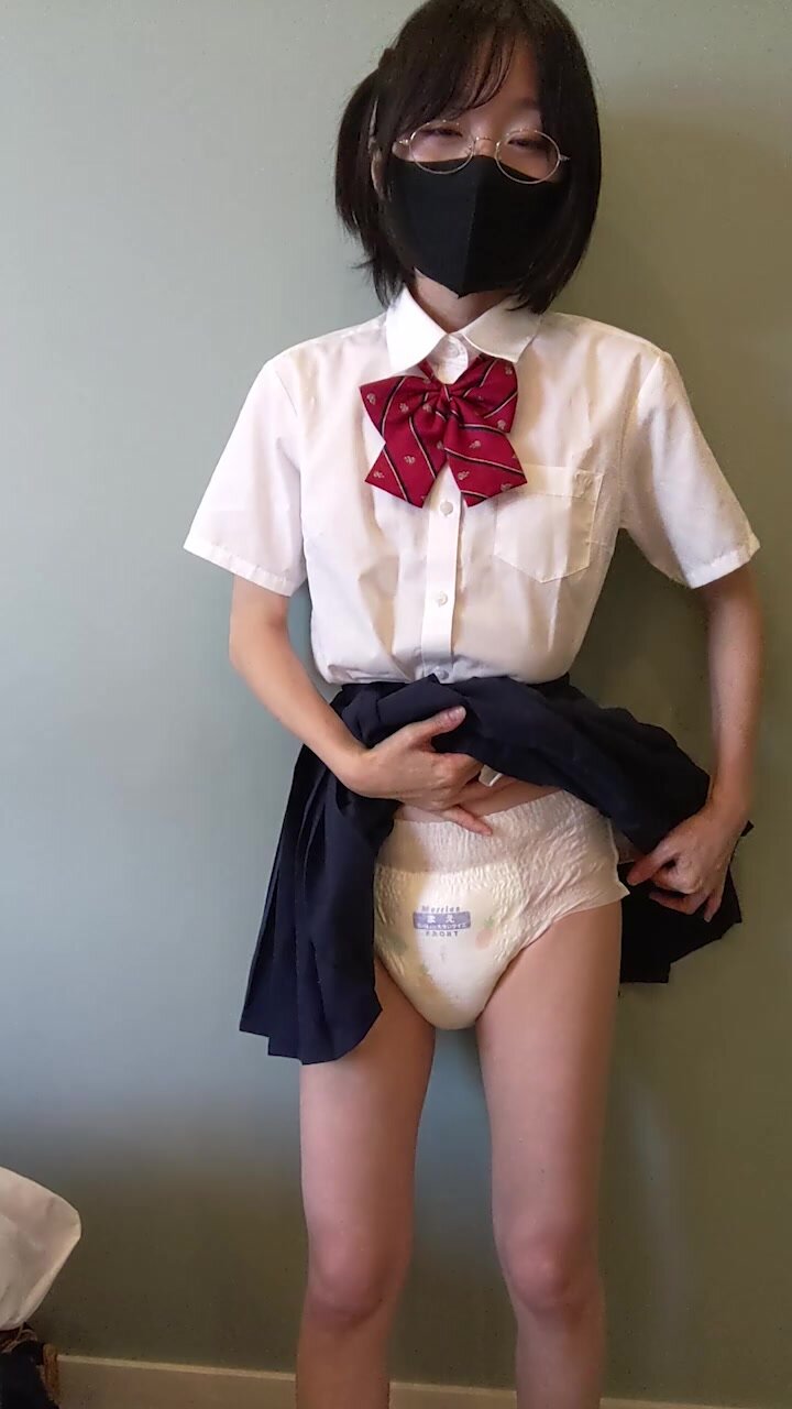 Schoolgirl shows her diapers