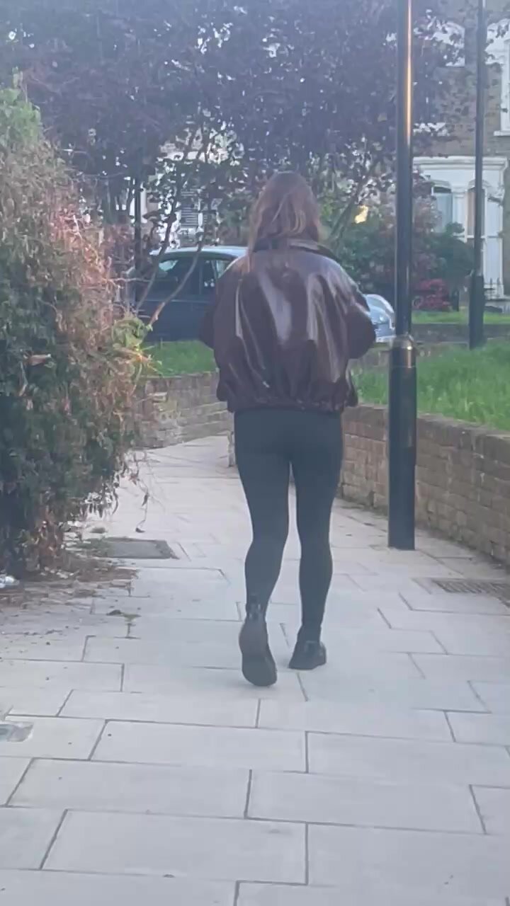 Slim brunette walking in leggings - video 2