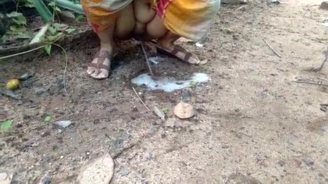 Aunty pissing in forest