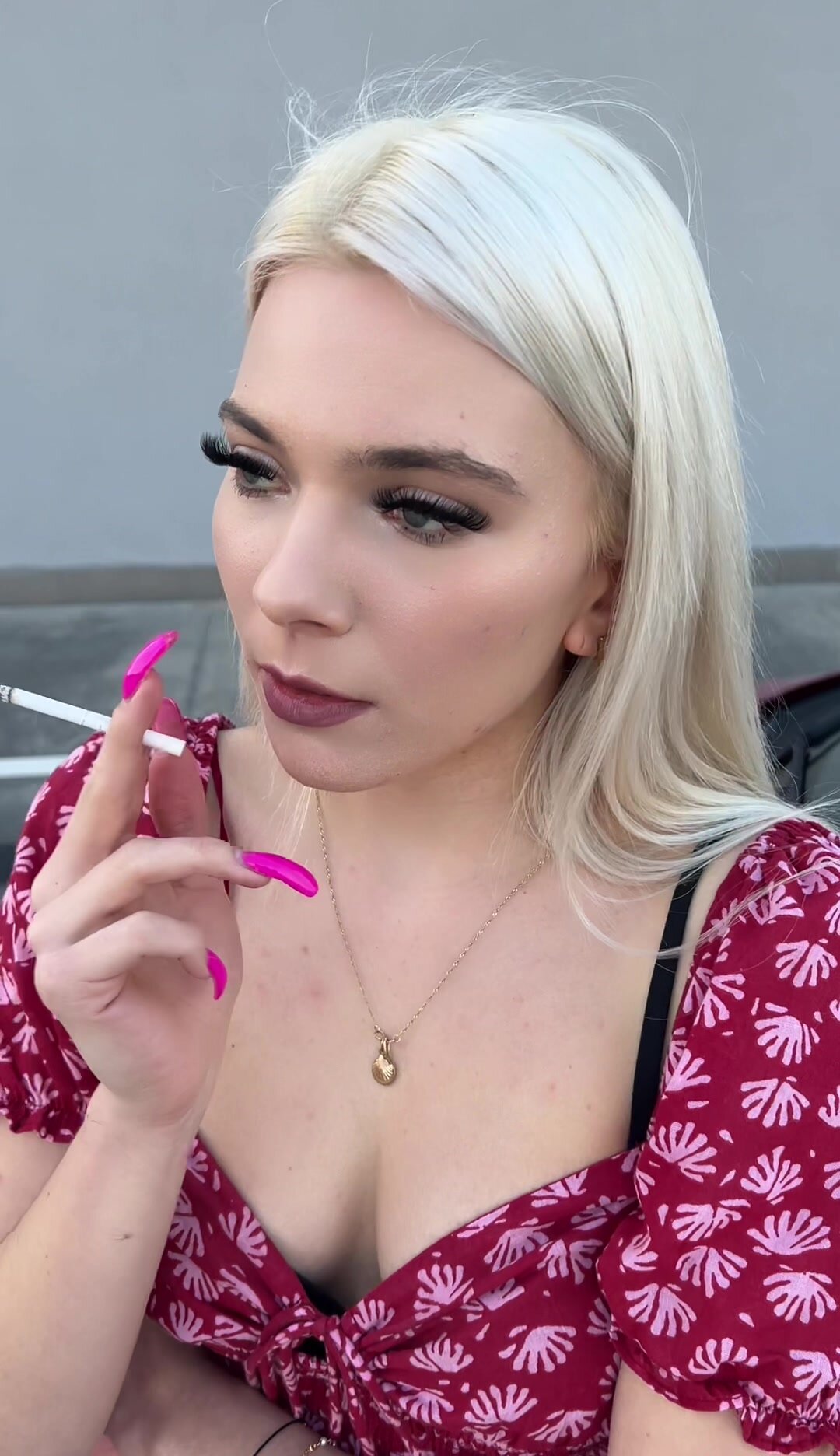 A nice blondie teen is smoking and spitting