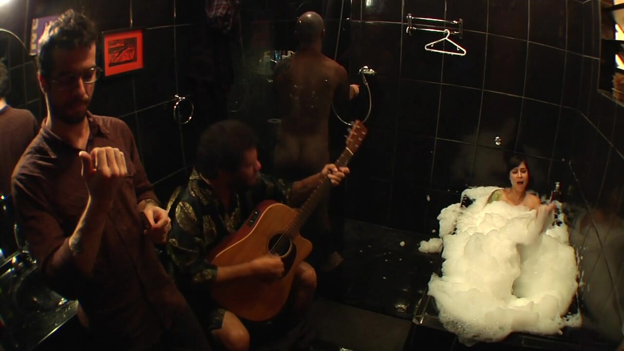 band member takes a shower in music video