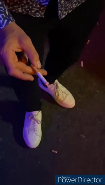 candid sneakers in a club