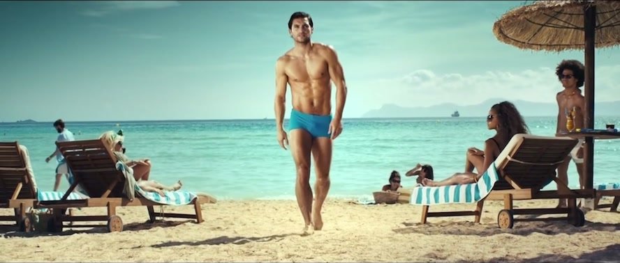 Hot hunk in tight trunks advert