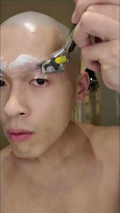 Asian twink shaving eyebrows