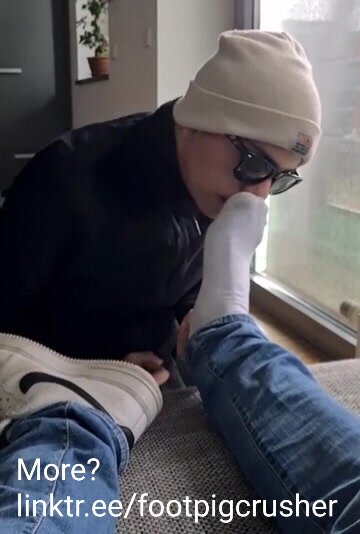 Submissive boy sniffs my smelly gym socks and feet