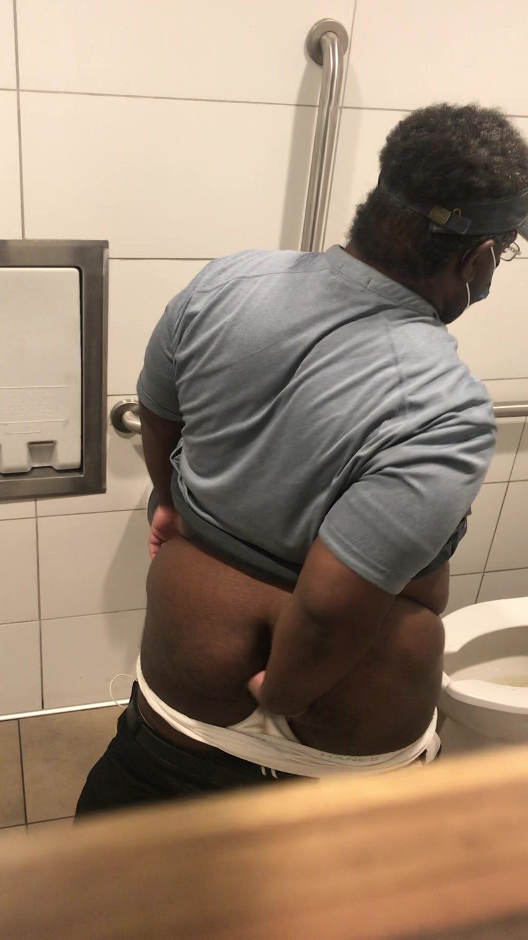 Old black man wiping bubble butt