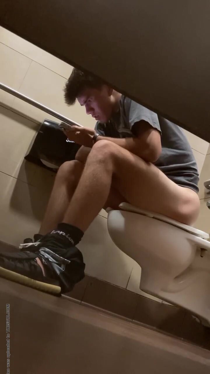 Fit young guy taking  a dump