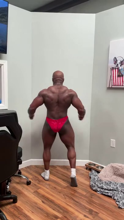 Black Muscle Man Posing in Red