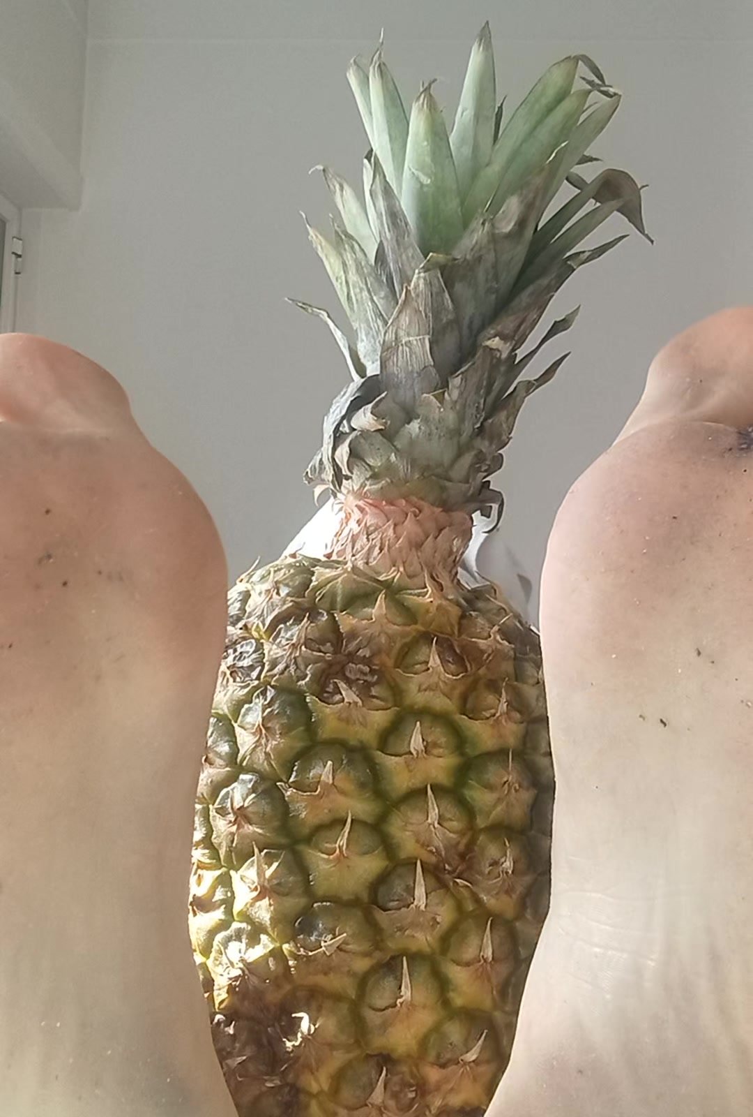 My awesome feet playing with pineapple