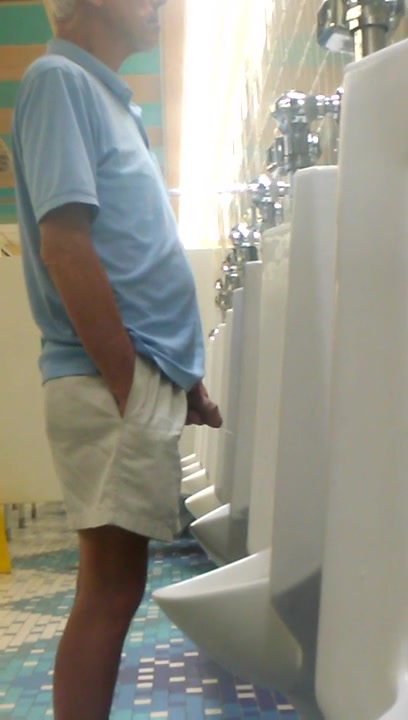 slender daddy with a nice dick at the urinal