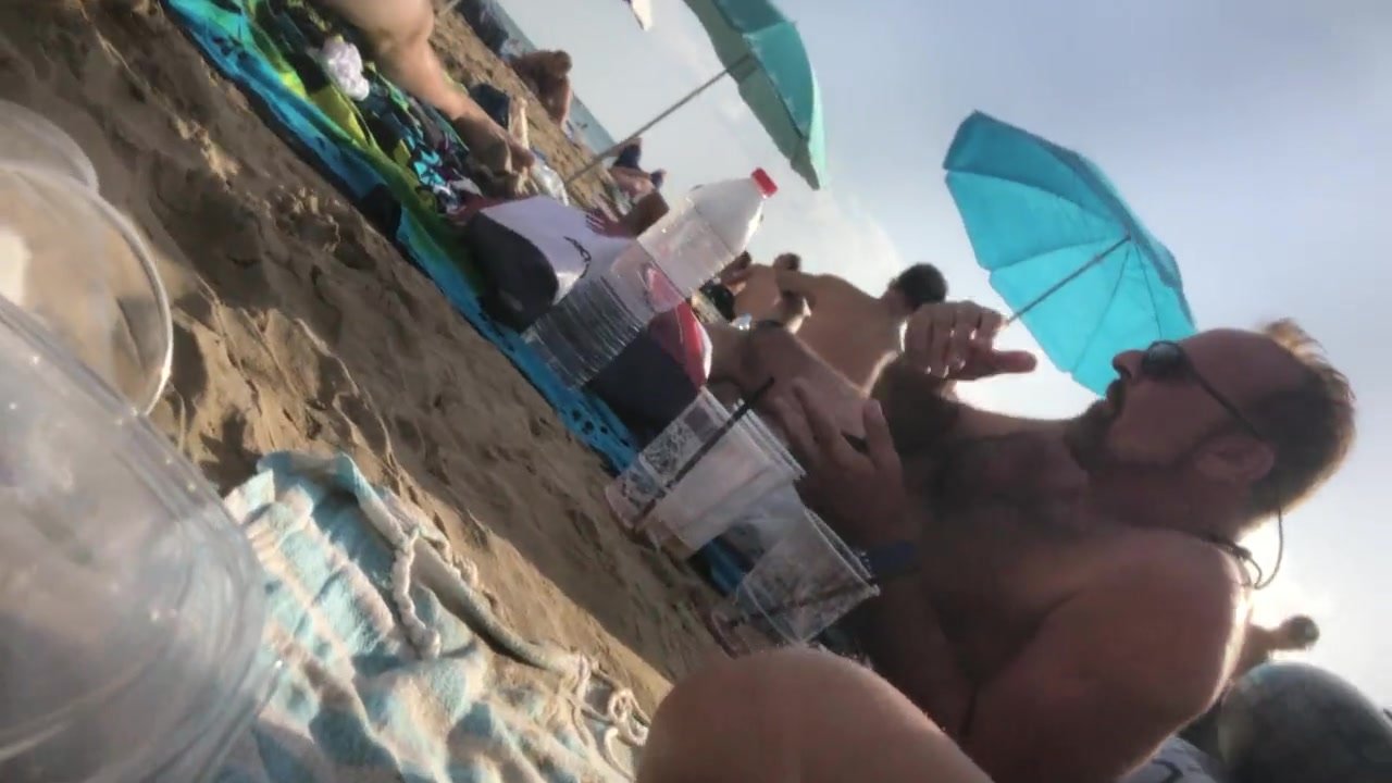 Daddy rocking boner on nude beach