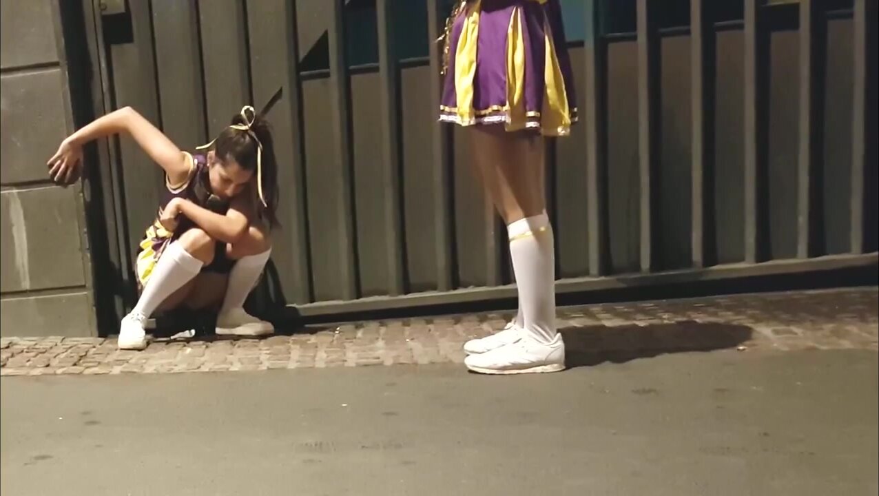 Cute cheerleader pees in public