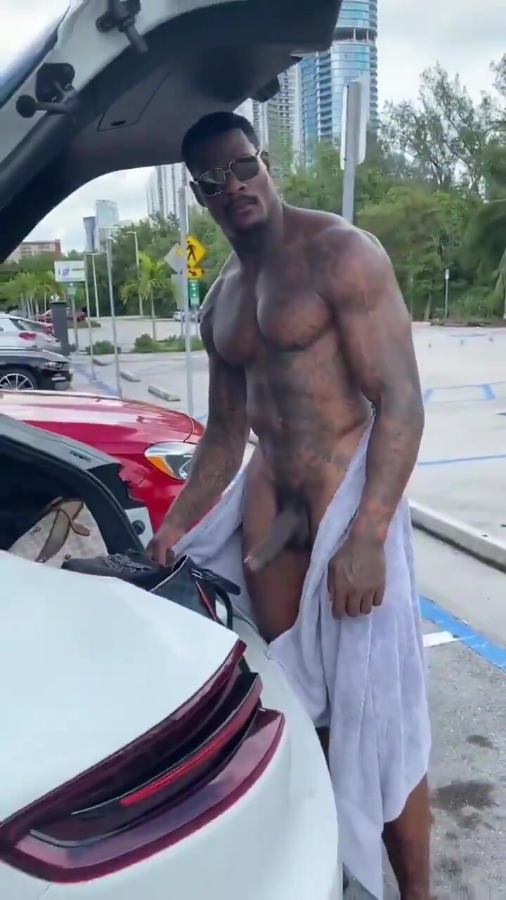 Black daddy shows off huge cock in public parking lot